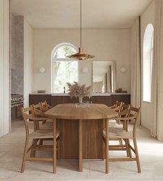 a dining room table with chairs around it