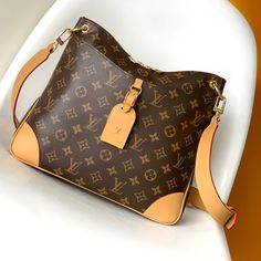 The top original single Louis Vuitton launched the new Odeon medium handbag in the autumn and winter of 2020, which conveys a retro flavor with Monogram canvas and reinforced leather corners. The adjustable shoulder strap makes it easy to carry on the shoulder or crossbody, and you can easily access the accompanying items by simply opening the zipper.

Size: 31.0 x 27.0 x 9.0 cm (LxHxW)
• Monogram coated canvas
• Semi-aged calfskin trim
• Textile lining
• metallic parts
• Leather corners Monogram Canvas Satchel Shoulder Bag For Shopping, Monogram Canvas Satchel Shoulder Bag With Removable Pouch, High-end Large Capacity Coated Canvas Shoulder Bag, Everyday Luxury Monogram Canvas Shoulder Bag, Monogram Canvas Satchel With Removable Pouch For Errands, Monogram Canvas Shoulder Bag With Detachable Handle For Shopping, Monogram Canvas Shoulder Bag With Removable Pouch For Errands, Monogram Canvas Crossbody Satchel For Shopping, Brown Monogram Canvas Top Handle Shoulder Bag