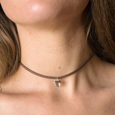 Introducing our Western Style Simple Heart Choker Necklace - a harmonious blend of bohemian charm and minimalist elegance. 🌿✨ This dainty piece, adorned with a tiny silver heart charm, exudes a free-spirited vibe, making it your perfect everyday accessory. Crafted with love, this necklace features a unique combination of Vegan Leather and stainless steel hardware, ensuring both style and sustainability. The hypoallergenic stainless steel makes it a comfortable choice for all skin types. Choose Adjustable Heart Shaped Clavicle Chain Necklaces, Adjustable Heart Pendant Clavicle Choker, Adjustable Clavicle Chain Choker With Heart Pendant, Delicate Adjustable Everyday Choker, Minimalist Adjustable Charm Necklace With Heart Pendant, Adjustable Heart Charm Choker Necklace, Adjustable Minimalist Heart Pendant Charm Necklace, Heart-shaped Adjustable Jewelry As Gift, Minimalist Adjustable Heart Pendant Charm Necklace