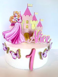 a birthday cake with an image of a princess and her castle on it's top