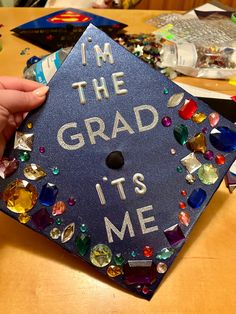 Graduation cap with lyrics from Taylor Swift’s song Anti-Hero surrounded by gems or various shapes and sizes. Reputation Graduation Cap, Graduation Cap Decoration Taylor Swift, Taylor Swift Grad Party, Mamma Mia Graduation Cap, Taylor Swift Graduation Cap Ideas, Taylor Swift Grad Cap Ideas, Graduation Cap Taylor Swift, Grad Cap Ideas Taylor Swift, Graduation Cap Designs Taylor Swift