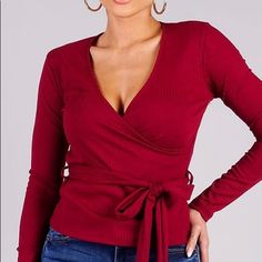 Ribbed Long Sleeve Wrap Knit Top With Waist Belt Detail 95% Polyester, 5% Spandex Made In Usa Desma Is 5’6″ And Wearing A Size S Fitted Knit V-neck Top, Chic Red Ribbed Top, Faux Wrap V-neck Top For Fall, Elegant Red Knit Top, Stretch V-neck Wrap Top For Fall, Stretch Knit V-neck Blouse, Red Ribbed V-neck Top, Burgundy V-neck Top For Summer, Red Knit V-neck Top