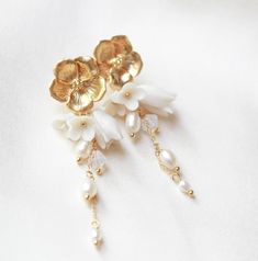 Floral Bridal Earrings, Gold Bridal Jewelry, Pearl Earrings for Bride, Long Wedding Earrings, Gold Flower Earrings Stud Earrings for Wedding - Etsy White Pearl Drop Clip-on Earrings For Wedding, Elegant Pearl White Jewelry With 3d Flowers, Elegant Rose Gold Flower-shaped Pearl Earrings, Elegant Rose Gold Flower Clip-on Earrings, Elegant Pearl White Flower Earrings With 3d Details, Elegant Pearl Earrings With 3d Flowers, Elegant Floral Clip-on Earrings For Formal Occasions, Elegant Rose Gold Flower-shaped Bridal Earrings, Delicate Flower Pearl Drop Earrings