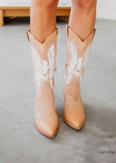 The Idaly Western Midi Boots offer a sleek and stylish look with a pointed toe and midi boot design. The western etching adds a touch of unique charm, while the stacked heel provides comfortable support. Heel: 2" Midi Boots, Boot Design, Western Look, Curvy Dress, Cowboy Boot, Designer Boots, Toe Designs, Unique Charms, Stacked Heel