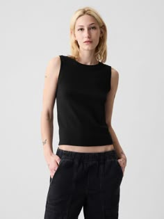 Slightly cropped soft knit tank top.  Crewneck.  Sleeveless.  Straight silhouette with a slim, slightly cropped fit.  Size up for a looser, longer fit.  Hits at the waist.  Models wearing Gap Modern Tank, Khaki Tops, Closet Tour, Black Sleeveless Top, Sleeveless Tee, Green And Khaki, Knit Tank, Knitted Tank Top, Knit Tanks