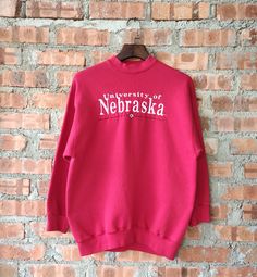 Vintage 90s University Of Nebraska Sweatshirt Nebraska Crewneck Nebraska Pullover Nebraska Sweater Embroidery Logo Red Color Men's Fit L Label : Velva Sheen Label Size : XL (refer the measurement) Made in USA Materials from 50% Cotton 50% Polyester Used Item With Condition 7/10 Refer Picture. No Stain and No Holes. Lay Down Flat Measurement : - Width (armpit to armpit) and: 22 Inches - Length (shoulder to end of garment): 28 Inches We are selling used clothing with good condition. DO NOT EXPECT Nebraska Sweatshirt, Sweater Embroidery, Embroidery Sweater, Men Fits, Used Clothing, Embroidery Logo, Nebraska, Vintage 90s, Red Color