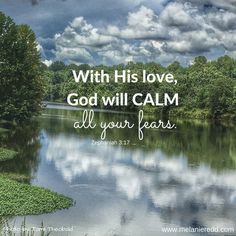 a lake with trees and clouds in the background, with a bible verse written on it