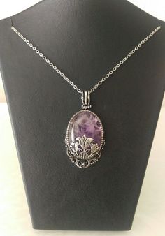 This amethyst gemstone pendant is a wonderful gift to yourself or to your loved one.This gemstone necklace is 17.7 inches length.Amethyst necklace is 1 inches width and 1.20 inches height. This gemstone pendant is wrapped in beautiful Victorian Style filigrees.(antiqued silver plated brass) Helps Purple Necklace With Large Stone For Gift, Spiritual Oval Pendant Crystal Necklace With Gemstone, Crystal Necklace With Oval Gemstone Pendant For Gifts, Gift Crystal Necklace With Oval Gemstone Pendant, Oval Pendant Crystal Necklace With Gemstone For Gift, Gift Oval Pendant Crystal Necklace With Gemstone, Spiritual Amethyst Crystal Necklace Gift, Elegant Amethyst Necklace For Healing, Amethyst Round Pendant For Healing