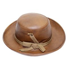 A brown leather Yves Saint Laurent hat. Excellent condition Measurements: Brim: 3 and 1/4 inches Crown height: 4 inches Inner circumference: 21.5 inches Yves Saint Laurent 1970s, Brown Leather Hat, Ivory Hat, Leather Crown, Yves Saint Laurent Couture, Brown Hat, Antique Hats, Crown Vintage, Crown Hat