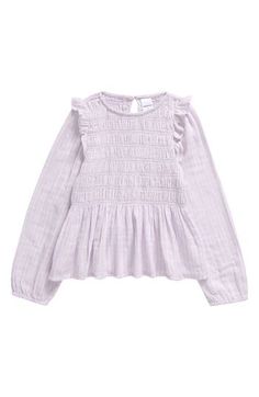 A smocked yoke and shoulder ruffles shape the stylish silhouette of this kid-sized top cut from lightweight cotton. Back keyhole with button-and-loop closure 100% cotton Machine wash, line dry Imported Spring Cotton Tops With Smocked Bodice, Smock Top With Ruffled Collar For Spring, Spring Cotton Peasant Top With Ruffles, Fall Cotton Peasant Top With Smocked Bodice, Cotton Peasant Top With Smocked Bodice For Fall, Cotton Smocked Bodice Top With Ruffle Sleeves, Cotton Top With Smocked Bodice And Ruffle Sleeves, Spring Cotton Smocked Top With Long Sleeves, Long Sleeve Cotton Top With Ruffle Hem