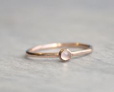 Beautiful birthstone stacking rings. Made in 14k rose gold filled and stone is a 3mm genuine rainbow moonstone. This ring is made to order in your size. If you don't see your size available please feel free to message me. All orders ship in a gift box. If you are ordering multiple items and want them boxed separately, please let me know in the notes at checkout. I ship via USPS. Please review the estimated delivery date and processing times. Processing times vary based on how busy my shop is at Dainty Rose Gold Moonstone Ring, Stackable Rose Gold Moonstone Ring, Stackable Round Moonstone Ring In Rose Gold, Minimalist 14k Rose Gold Moonstone Ring, Delicate Rose Gold Moonstone Ring With Birthstone, Minimalist Rose Gold Moonstone Promise Ring, Delicate Rose Gold Moonstone Birthstone Ring, Stackable Rose Gold Moonstone Ring For Promise, Stackable Rose Gold Moonstone Promise Ring