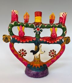 a colorful menorah with candles on it