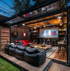 a living room filled with furniture and a flat screen tv mounted to the side of a wall