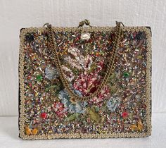 Vintage Veldore' of Houston, U.S.A. Bag Purse 1950's Applique Beaded Jeweled. Large size 10.6” at the widest x 8.6” tall x 2.4 deep bottom Chain drop 6.4” Hand decorated Original Veldore of Houston U.S.A Vintage condition ,decoration is in very nice condition,wear to corners Final sale Vintage Embellished Bag For Festive Occasions, Vintage Embellished Bags For Festive Occasions, Embellished Vintage Bags For Events, Vintage Bags For Festivals, Vintage Embellished Bags For Vintage Events, Vintage Beaded Evening Bag As Gift, Vintage Evening Bag With Handwork, Vintage Sequin Party Bag, Vintage Embellished Rectangular Bag