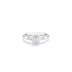 DB Classic emerald-cut and tapered diamond ring | De Beers US Fire Life, Platinum Engagement Rings, Emerald Cut Diamond Engagement Ring, Baguette Cut Diamond, Emerald Cut Diamond Engagement, Jewelry Images, Diamond Stacks, Engraved Items, Emerald Cut Diamonds