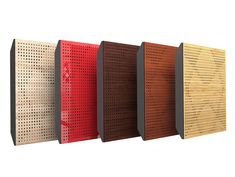 four different colored pegboard boards lined up next to each other on a white background