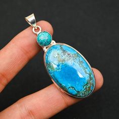 Turquoise Pendant, 925 Sterling Silver Pendant, Wedding Jewelry, Silver Necklace, Bohemian Pendant, Women Engagement Jewelry Gemstone Name - Turquoise  Pendant Size -  2.5 x 0.9 Purity-  925 Parts Per 1000 All Our Jewelry Is 925 Stamped. Shipping Policy We do ship through DHL, UPS, INDIA POST Try to keep it away from water. If it comes in contact of water then clean with a dry cotton cloth ASAP for the polish to stay longer. Shipping through DHL Express shipping available in USA, UK and Australia The pictures in the listing are EXAMPLES ONLY. No two gemstones are exactly alike. Your gemstone might look SLIGHTLY different, but I assure you it will be of excellent quality. If you want to see your gemstone or your ring before buying or before shipping, PLEASE MESSAGE ME and I will be happy to Bohemian Turquoise Gemstones In Sterling Silver, Turquoise Chrysocolla Jewelry For Anniversary, Turquoise Sterling Silver Necklace For Wedding, Turquoise Natural Stones Wedding Jewelry, Turquoise Pendant Jewelry For Wedding, Turquoise Wedding Jewelry With Natural Stones, Wedding Jewelry Silver, India Post, Jewelry Gemstone