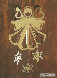 an ornament is hanging on the side of a door with stars around it