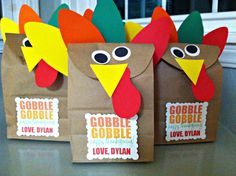 three paper bags with turkeys on them sitting on a table next to each other