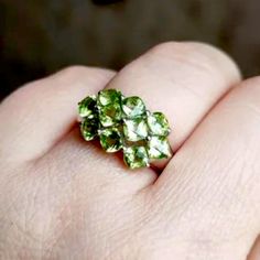 Stunning 3.6ct Natural Cushion Checkerboard Top Cut Peridot With 10, 4mm Stones In A Rhodium Plated High Polish Solid Sterling Silver Ring, Stamped 925 Is Unique And One Of A Kind! These Exquisite Cut Beautiful Stones Give The Piece A Ton Of Fire & Brilliance That Photos Cannot Do Justice! Handmade One Of A Kind Fine Jewelry Did You Know Peridot Is Created In Earths Mantle? It’s Brought To The Surface Through Volcanic Eruptions & Found In Basalt. It Has Been Mined Since Egyptian Times & The Gems Classic Multi-stone Green Gemstones, Classic Green Multi-stone Gemstones, Green Multi-stone Sterling Silver Rings, Green Cluster Rings Hallmarked, Green Cluster Hallmarked Rings, Green Hallmarked Cluster Jewelry, Sterling Silver Multi-stone Green Emerald Ring, Green Multi-stone Emerald Ring In Sterling Silver, Green Faceted Gemstones For Anniversary