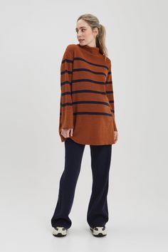 Our favorite sweater of the season, the Sarabeth is knitted in a super chic rust / navy stripe that pairs back perfectly to our Seamless legging or BFF denim. Made in our recycled fabric, this sweater has hidden zippers for easy nursing access. NOM is designed and built to last during, for nursing + after. FREE shipping and returns on all US orders CARE + DETAILSMachine wash. Lay flat to dry.33% Nylon 28% Recycled Polyester 19% Acrylic 16% PBT 4% Wool FIT + SIZE GUIDEFits true to size26.5" Nursing Sweater, Turtle Neck Long Sleeve, Maternity Brands, Baby Wrap Carrier, Sleep And Loungewear, Nursing Tops, Maternity Sweater, Favorite Sweater, Mock Turtleneck