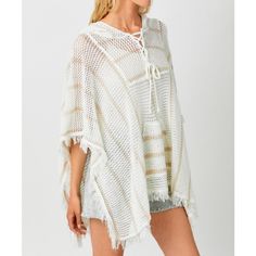 Details & Care - Ivory color - Beige stripes design - V-neckline - Front lace up detail - Large front pocket - Fringe bottom detail - Poncho hoodie - Available in sizes S/M, M/L - Fabric: 60% cotton, 40% acrylic - Hand wash in cold water. Hang to dry. Size Info Small/Medium (S/M): 2 - 8 Medium/Large (M/L): 8 - 12 Need help knowing your size? Use our size guide. Model Measurements Model is 5'9" and wearing a size S/M.