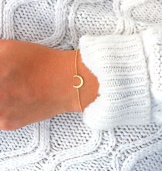 Dainty Crescent Moon Bracelet with delicate hammered finish. Perfect minimalist and dainty design that makes for a gorgeous and affordable gift. D E S I G N ∙ D E T A I L S * Available in gold plated or silver plated * The Crescent moon measures 9 mm or approximately 0.4 inch * Length on model 6.25 inch (model wears size xs or small blouse and has a relatively small wrist)  ● Optional 1/2 inch Extender available.   G I F T ∙ P A C K A G I N G  * Each purchase will arrive in beautifully crafted gift packaging.   * Gift packaging is included for FREE (no extra cost). * Want a special gift note card created?     * * Leave a note at checkout with your gift message.       * * I'll create a complimentary gift card with your message and add it to your gift packaging.  T U R N ∙ A R O U N D ∙ T I Gold Minimalist Moon Bracelet, Minimalist Gold Moon Bracelet, Minimalist Moon Shaped Gold Bracelet, Minimalist Moon-shaped Gold Bracelet, Minimalist Bracelet With Moon Charm As Gift, Minimalist Bracelets With Moon Charm As Gift, Dainty Moon Shaped Bracelets As Gift, Dainty Crescent Bracelet As Gift, Dainty Crescent Bracelet For Gift