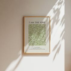 an image of i am the vine poster hanging on a wall in a room with white walls