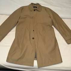 ***Brand New*** **Perfect Condition** **Worn Once** Size: 38r Warm, Water Repellent Camel Dress Raincoat From The Lauren Label Of Ralph Lauren. Brand New And Only Worn Once, This Coat Is In Perfect Condition And Will Be A Perfect Addition To Your Fall/Winter Wardrobe. Tab And Button Details At Sleeves; Center Vent Slash Pockets At Front Shirt Collar; Single-Breasted Button Closures At Front Classic Khaki Pea Coat For Business, Classic Khaki Pea Coat, Brown Gabardine Outerwear For Business, Khaki Outerwear With Lapel Collar For Business Casual, Khaki Lapel Collar Outerwear For Business Casual, Khaki Business Casual Outerwear With Lapel Collar, Unstructured Business Outerwear For Fall, Classic Khaki Outerwear With Hidden Buttons, Classic Khaki Outerwear With Lapel Collar