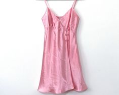 Vintage La Vie En Rose baby pink satin mini slip dress. Adjustable spaghetti straps and cute flower button details. 3 Embroidered floral buttons, and overlapping skirt, makes a perfect dress for a party night out. Pit to pit 16" Waist 15"  Length 35" Great condition no rips tears or stains Dress For A Party, Baby Pink Satin, Lingerie Vintage, Pink Mini Dress, Flower Button, Dress Slip, Mini Slip, Mini Slip Dress, Button Flowers