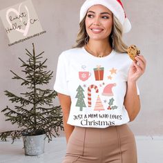 **Please place orders by DECEMBER 9TH, 2024 to ensure Christmas Delivery** JUST A MOM WHO LOVES Christmas T-Shirt Unisex jersey short sleeve t-shirt. These t-shirts have-ribbed knit collars to bolster shaping. The shoulders have taping for better fit over time. Dual side seams hold the garment's shape for longer.  -100% Airlume combed and ringspun cotton (fiber content may vary for different colors) -Light fabric (4.2 oz/yd² (142 g/m -Tear away label -Runs true to size Order Process: -The proces White Christmas Graphic Tee Tops, White Short Sleeve Christmas T-shirt, White Christmas Graphic Tee, White Crew Neck T-shirt For Christmas, White Graphic Tee For Holiday, Holiday White Graphic Tee Top, White Short Sleeve Christmas Top, Holiday White Graphic Tee, White Short Sleeve Top For Christmas