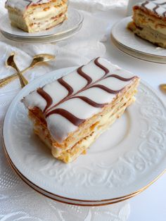 some desserts are sitting on plates on a table