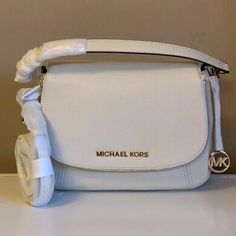 Questions? Leave A Comment Below! Elegant White Flap Bag, Elegant White Flap Shoulder Bag, Michael Kors Crossbody Satchel With Detachable Handle, Classic White Flap Bag For Shopping, White Flap Shoulder Bag With Detachable Handle, White Flap Bag For Travel With Dust Bag, Michael Kors Crossbody Satchel, White Flap Bag With Detachable Handle, White Flap Bag With Detachable Strap