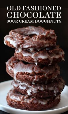 old fashioned chocolate sour cream doughnuts on a white plate with text overlay