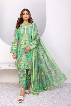 DESCRIPTION - Digital Lawn Parrot Green Floral Printed Shirt - Finished with Fashion of Plain Fabric on Sleeves and Neckline - Printed Floral Lawn Trouser - Floral Printed Bamber Chiffon Dupatta Finished with Patti of Plain Fabric Measurement Length 36" 36" 38" 38" Flare/ Daman Width 26" 26" 28" 28" Chiffon Lawn Suit With Sheer Dupatta And Long Sleeves, Long Sleeve Chiffon Lawn Suit With Sheer Dupatta, Green Sets With Sheer Dupatta For Spring, Printed Long Sleeve Salwar Kameez For Summer, Green Georgette Salwar Kameez With Printed Motifs, Green Salwar Kameez With Printed Motifs In Georgette, Unstitched Chiffon Sets For Summer, Long Sleeve Georgette Salwar Kameez For Summer, Green Long Sleeve Lawn Suit With Printed Motifs