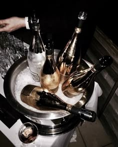 several bottles of champagne are sitting in an ice bucket