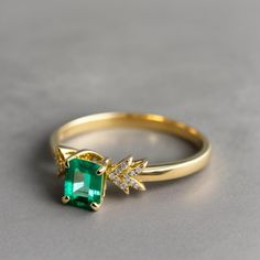 Natural Emerald Diamond Ring - 2 Carat Zambian Emerald ring, 14k Gold Emerald Ring, Unique Designer Emerald Ring, Birthday Gift Ring Emerald GEMSTONE DETAILS : ✦ Gemstone : Natural Zambia Emerald ✦ Gemstone Size : 8 x 10 mm ✦ Gemstone Shape : Emerald Cut ✦ Number of Gemstones : 1 ✦ Gemstone Weight : 2 Carat ✦ Gemstone Grade : Vivid DIAMOND DETAILS : ✦ Diamond Type : Natural ✦ Diamond Size : 1.5 MM ✦ Diamond Color : G-H ✦ Diamond Clarity : Slightly included ✦ Diamond Cut : Excellent ✦ Diamond Wei 14k Gold Gia Certified Rings With May Birthstone, Yellow Gold Cluster Ring For May Birthstone, Emerald Cut, Yellow Gold Cluster Ring With Emerald Cut May Birthstone, Anniversary Emerald Ring, Gia Certified, 14k Gold, Anniversary 14k Gold Emerald Ring Gia Certified, Emerald Cut Yellow Gold Cluster Ring For May Birthstone, Anniversary 14k Gold Gia Certified Emerald Ring, Gia Certified Emerald Ring In 14k Gold For Anniversary, Gia Certified Diamond Ring May Birthstone Gift