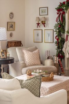 a living room filled with furniture and christmas decorations