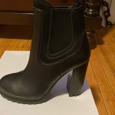 Never Worn Black Ankle Boots. Trendy Synthetic Heeled Boots With Lug Sole, Trendy Formal Synthetic Boots, Chic Synthetic Boots With Block Heel, Chic High Heel Boots With Lug Sole, Chic Synthetic Boots With Padded Heel, Casual Synthetic Platform Heeled Boots, Casual Party Boots With Padded Ankle, Chic Synthetic Ankle Platform Boots, Casual High Heel Synthetic Boots