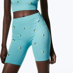 High Waist 96% Polyamide, 4% Elastane Ribbed Blue With Embroidered Lemons Size Xs/S Length: 16.5'' , Inseam: 6'', Waist: 23''(Flat) New With Tag B-3(5) Blue Seamless Shorts For Summer, Seamless Biker Shorts For Spring, Spring Yellow Seamless Bottoms, Blue Seamless Biker Shorts, Green Seamless Biker Shorts For Summer, Yellow Biker Shorts For Summer Workout, Blue Mid-thigh Length Shorts For Spring, Blue Mid-thigh Length Spring Shorts, Spring Yellow Stretch Biker Shorts