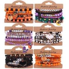 six bracelets with halloween charms on them