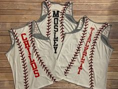 two women's baseball shirts with the word motley written on them in red and white