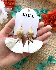 Materials Brass, 18k Gold Plated Fishhooks, Wood Beads, Raffia Tassels, Rattan Beads Dimensions Drop length: 3.5 Inches; Width: 2.0 Inches If you're looking for a bright white pair of statement earrings this summer, then these raffia tassel earrings are for you! They feature a large, beige, rattan bead accented with tiny wooden beads and bright white raffia tassels. They are lightweight and easy to wear all day long.These earrings drop approximately 3.5" inches from the lobe and measure about 2. Raffia Tassel, Flower Jewelry Designs, Earrings Drop, Flower Jewellery, Fish Hook, Tassel Earrings, Wooden Beads, Wood Beads, Bright White