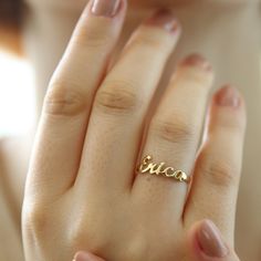 "14K Solid Gold Name Ring-Dainty Name Ring- Custom Stacking Name Ring - Birthday Gift- Bridesmaid-Gift For Mom-Gift For Her 14K Solid Gold Name ring will be handmade with your desired, Here is a dainty, delicate and simple, yet classy minimalist Name Ring . This is 14k Solid Yellow Gold. (this necklace is 100% real. It's not plated ) Perfect for everyday use. A beautiful customized gift for yourself or someone you care for. \"What's in a name?\" Spell out a name and let us create a beautiful gif Named Wedding Rings, Gold Ring Name Design, Custom Name Stackable 14k Gold Rings For Wedding, Personalized Gold Sterling Silver Birthstone Ring, Silver Birthstone Ring With Names For Wedding, Rose Gold Sterling Silver Initial Ring For Wedding, Delicate Gold Birthstone Ring For Wedding, Delicate Yellow Gold Engraved Ring For Anniversary, Elegant Yellow Gold Stackable Rings With Custom Name