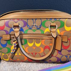 H: 8", L: 10.25", D: 5.25" Med Size Purse, New Without Tags Questions? Leave A Comment Below! Designer Multicolor Satchel, Luxury Multicolor Coach Bag, Multicolor Coach Top Handle Satchel, Coach Multicolor Top Handle Satchel, Designer Multicolor Satchel With Gold-tone Hardware, Multicolor Satchel With Gold-tone Hardware, Multicolor Coach Bags With Gold-tone Hardware, Coach Multicolor Bags With Gold-tone Hardware, Designer Multicolor Crossbody Satchel