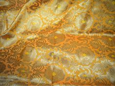 "Yellow Brocade Fabric by the Yard Gold Banaras Brocade Fabric Wedding Dress Banarasi Blended Silk Indian Fabric For Lehenga Home furnishing. This is a beautiful heavy Two Tone Yellow, Peach and Gold Banarasi blended silk brocade floral design fabric. ➤Product: Brocade Fabric ➤Fabric Type: Blended Silk (Viscose and Silk) Fine quality Zari Brocade Weaving from Banaras ➤Color: Two Tones Yellow, Peach and Gold ➤Width: 44 inches. ➤Condition: New ➤Code: bg1101 ➤Listing for 1 Yard of fabric. ➤Care: Dr Gold Brocade Lehenga For Puja, Yellow Brocade Lehenga, Fabric For Lehenga, Fabric Wedding Dress, Peach And Gold, Indian Fabric, Wedding Fabric, Silk Brocade, Design Fabric