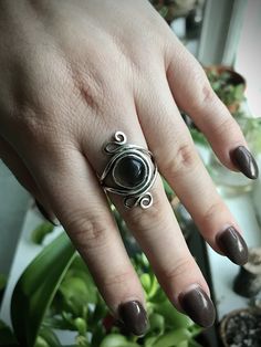 This is a hand-forged sterling silver ring featuring an obsidian cabochon. Original design. Oxidized and polished for a gorgeous, highlighted finish. Size 9.5. I start with sterling silver wire, sheet, and stone cabochons and go from there. Every piece is carefully fabricated from scratch using traditional metalsmithing techniques, resulting in unique, wearable art. Silver Obsidian, Mountain Jewelry, Metalsmithing Jewelry, Spiral Ring, Cabochons Stones, Oct 31, Hand Forged, Silver Wire, Rings Statement