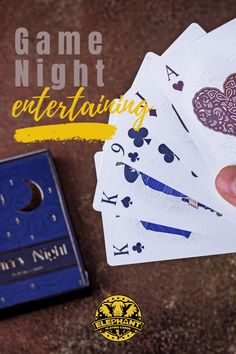 a hand holding four playing cards with the words game night entertaining in front of it