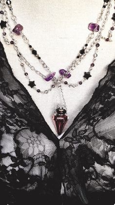 Here is a  Victorian or Gothic style necklace that I made with  -a set of intertwined chains,  -Amethyst stones and  -a real glass vial to fill with a magical elixir for the Witches' ball;  or a bit of captivating perfume for a romantic date. Add mystery to your jewelry, a hint of Alchemy, a touch of madness...   🌹A unique creation! entirely handmade. 🎁Here is a gift idea for a stylish...and special person! Delivered in its gift box, and packaged with care.❤️               Feel free to ask me Witches Ball, Gothic Chic, Victorian Necklace, Necklace Gothic, Amethyst Stones, French Jewelry, Chic Necklace, Romantic Dates, Jewelry Unique