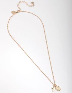 Description Delicate chains are versatile pieces that can be worn on their own for a classic look, or they can easily be stacked with other jewellery for big impact. This gold necklace is plated with genuine gold, and features a hanging cross pendant and an ornate coin. Length: 46cm + 8.5cm chain extension Pendant: 9mm (L) x 9mm (W) Weight: 3.91g | Lovisa Real Gold Plated Cross and Coin Necklace Gold Plated Cross Necklace With Delicate Chain, Gold Plated Delicate Chain Necklace With Cross Pendant, Gold Plated Cross Pendant Necklace With Gold Chain, Gold Charm Necklaces With Cross Pendant And Adjustable Chain, Gold Cross Pendant Charm Necklace With Adjustable Chain, Gold Necklaces With Delicate Chain And Cross Pendant, Gold Charm Necklace With Cross Pendant And Adjustable Chain, Minimalist Gold Chain Necklace With Cross Pendant, Gold Cross Necklace With Delicate Pendant